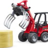 Schaeffer Compact loader 2630 with bale gripper and 1 round bale - Image 2